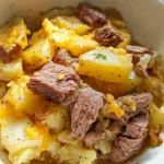 Slow Cooker Steak and Cheddar Potato Casserole